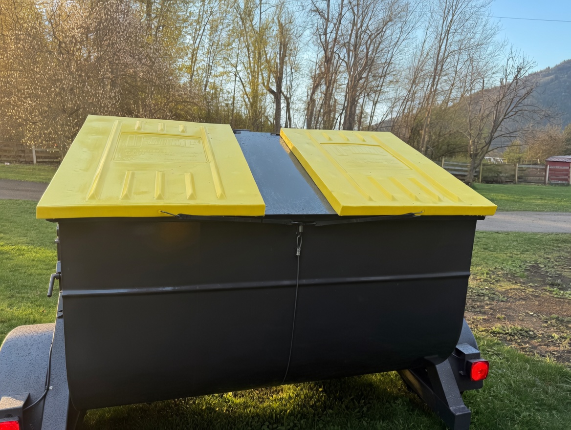 Trailer-style refuse bin in a rural Kootenay setting